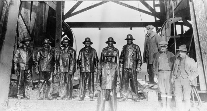 Roughnecks after capping an oil well in the Salt Creek field, 1920s. American Heritage Center, University of Wyoming.