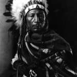 Calvin Littleshield, known also as Crooked Wrist, in ceremonial dress, Arapaho, 1913. Joseph Dixon photo, Wyoming Veterans Memorial Museum. 