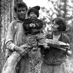 Olaus, Martin and Mardy Murie with the tusk of a woolly mammoth, Old Crow, Alaska, 1926. The Murie Center.