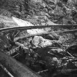 The completed tie flume transported about 300,000 ties per season to the Wind River. Extra water ran in the smaller aqueduct below the main flume. Wyoming State Archives.