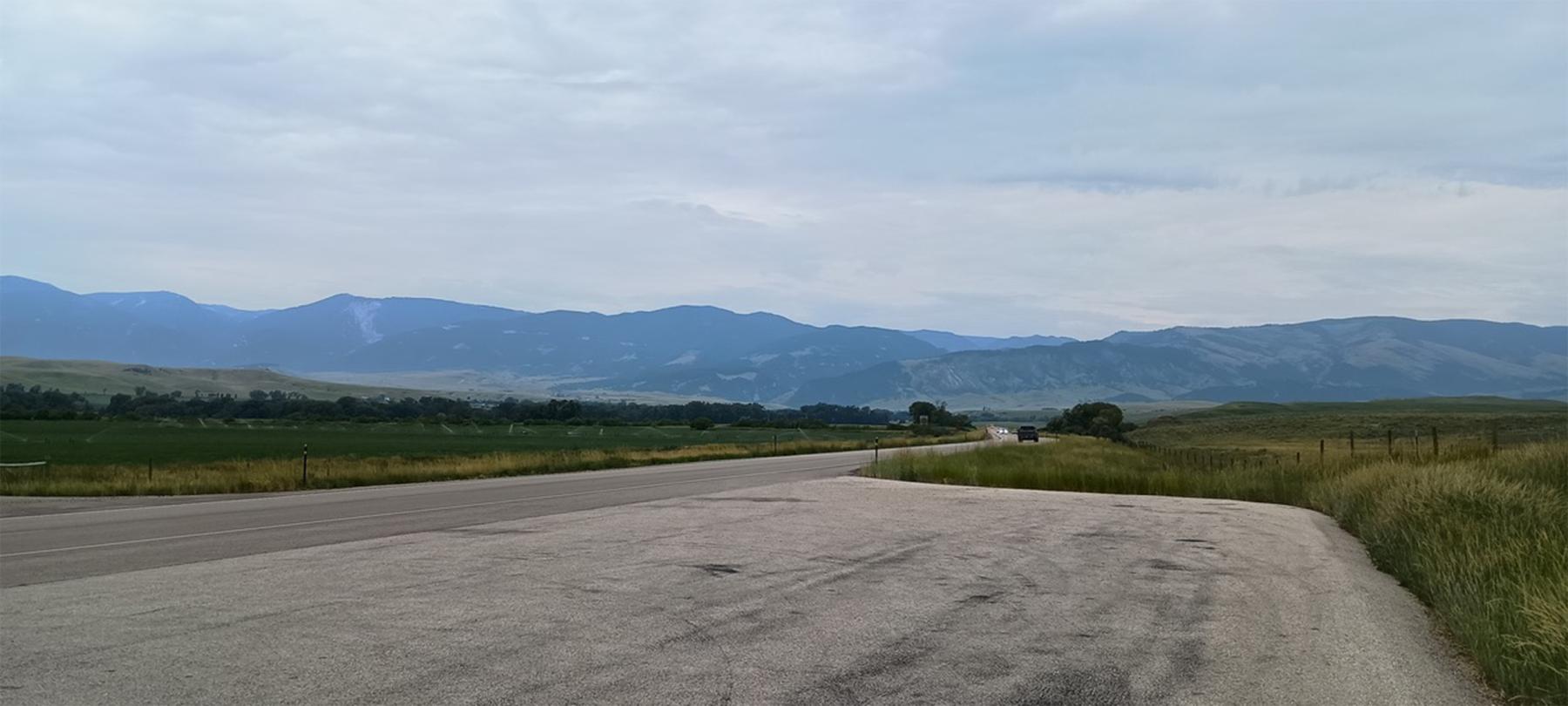 Looking west toward the Bighorn Mountains from a spot between Ranchester and Dayton, Wyoming, near where the Bozeman Trail crossed the Tongue River.  Seeking vengeance for Gen. Patrick Connor’s attack on their nearby village just days earlier, Arapaho warriors attacked the Sawyers Expedition near here. Both sides ended up negotiating while awaiting word from General Connor. During the interim, the civilians in the expedition threatened mutiny if James Sawyers remained in charge. Author photo.