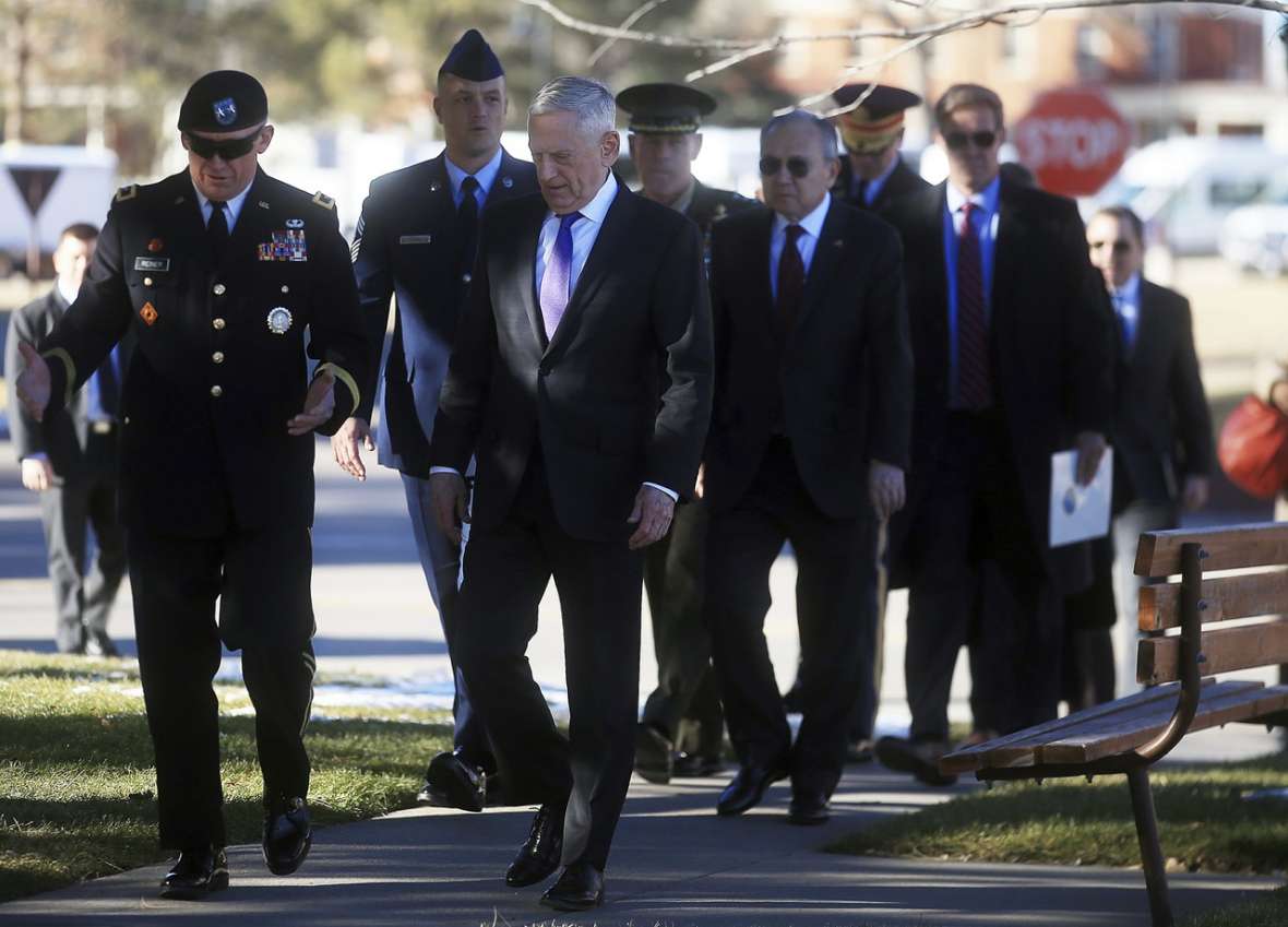 U.S. Secretary of Defense Jim Mattis, center, and behind his left shoulder Philippines Ambassador H.E. Jose Manuel G. Romualdez at a ceremony at FE Warren AFB in Cheyenne, November 14, 2018, to announce the return of the bells to the Philippines. Below, the bells are unloaded in Manila, December 11, 2018. AP, NPR photos.