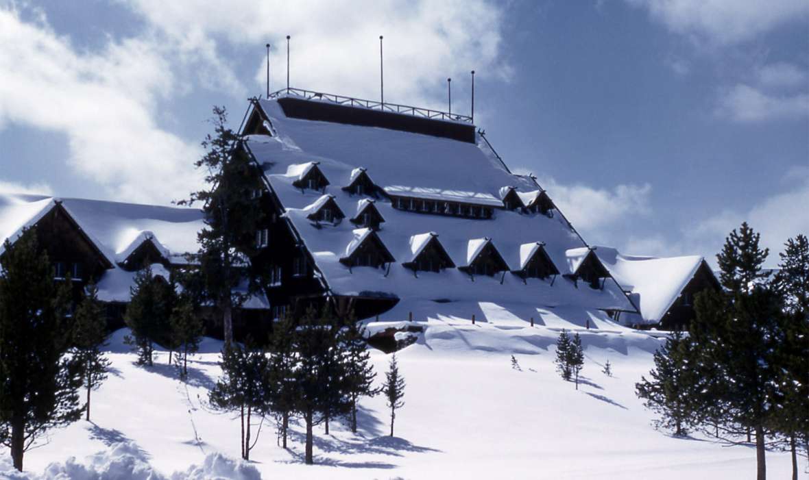 Old Faithful Inn. Even in winter, dormers scattered across its great, sloping roof bring daylight into the hotel’s expansive, seven-story lobby. NPS photo.