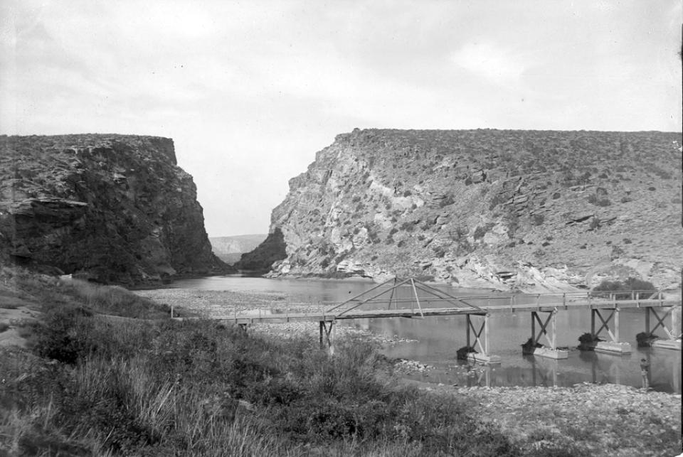 One of the few bridges across the North Platte in central Wyoming, shown here in 1899, was just upstream from  Alcova Canyon. American Heritage Center.