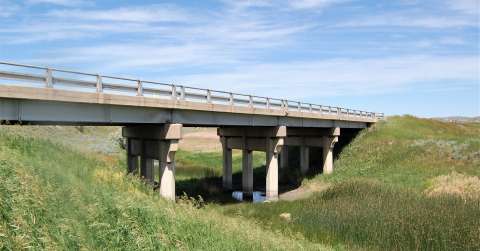 This single-span wide flange steel girder bridge crosses Rawhide Creek north of Gillette on U.S. Route 14-16.  It was built in 1941, when the Black and Yellow Trail was reconstructed in this area. Authors photo,  2017.