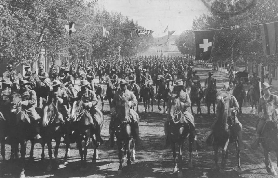 Troopers of the 9th Cavalry ride into Douglas, Wyo. during the state fair, 1908. Wyoming State Archives.