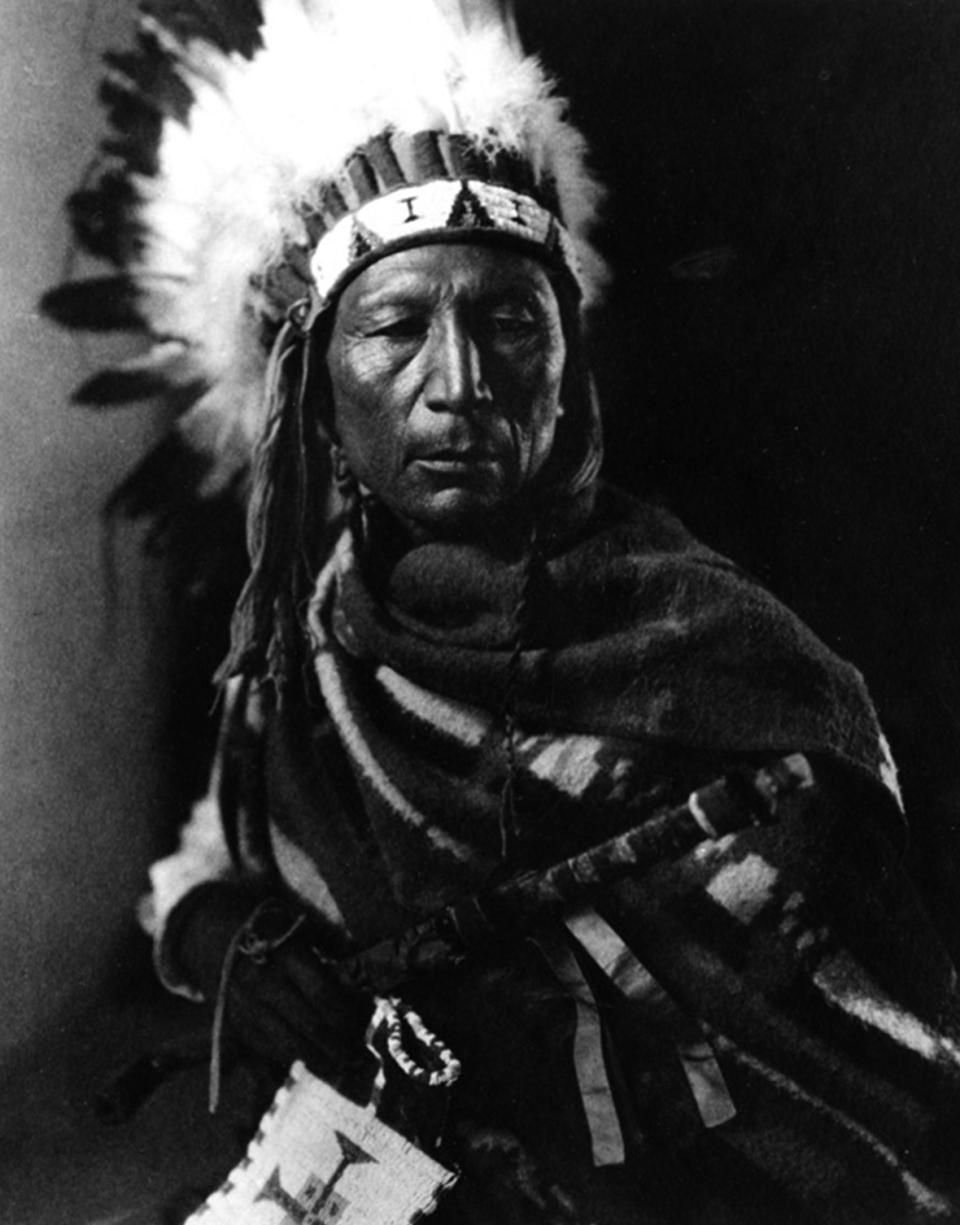 Calvin Littleshield, known also as Crooked Wrist, in ceremonial dress, Arapaho, 1913. Joseph Dixon photo, Wyoming Veterans Memorial Museum. 