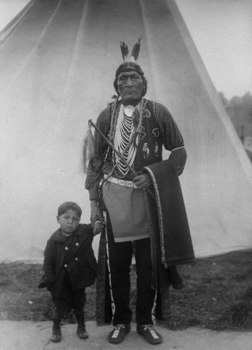 Arapaho members of the cast of "The Covered Wagon" traveled to London and Paris in 1923 to act in stage prologues before the movie showings. Shown here, Yellow Horse and an unidentified boy in London. Lander Pioneer Museum.