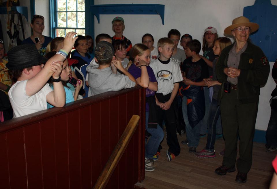 Fourth graders from Oregon Trail Elementary School in Casper, Wyo. visit the cavalry barracks in the spring of 2012. Tom Rea photo.