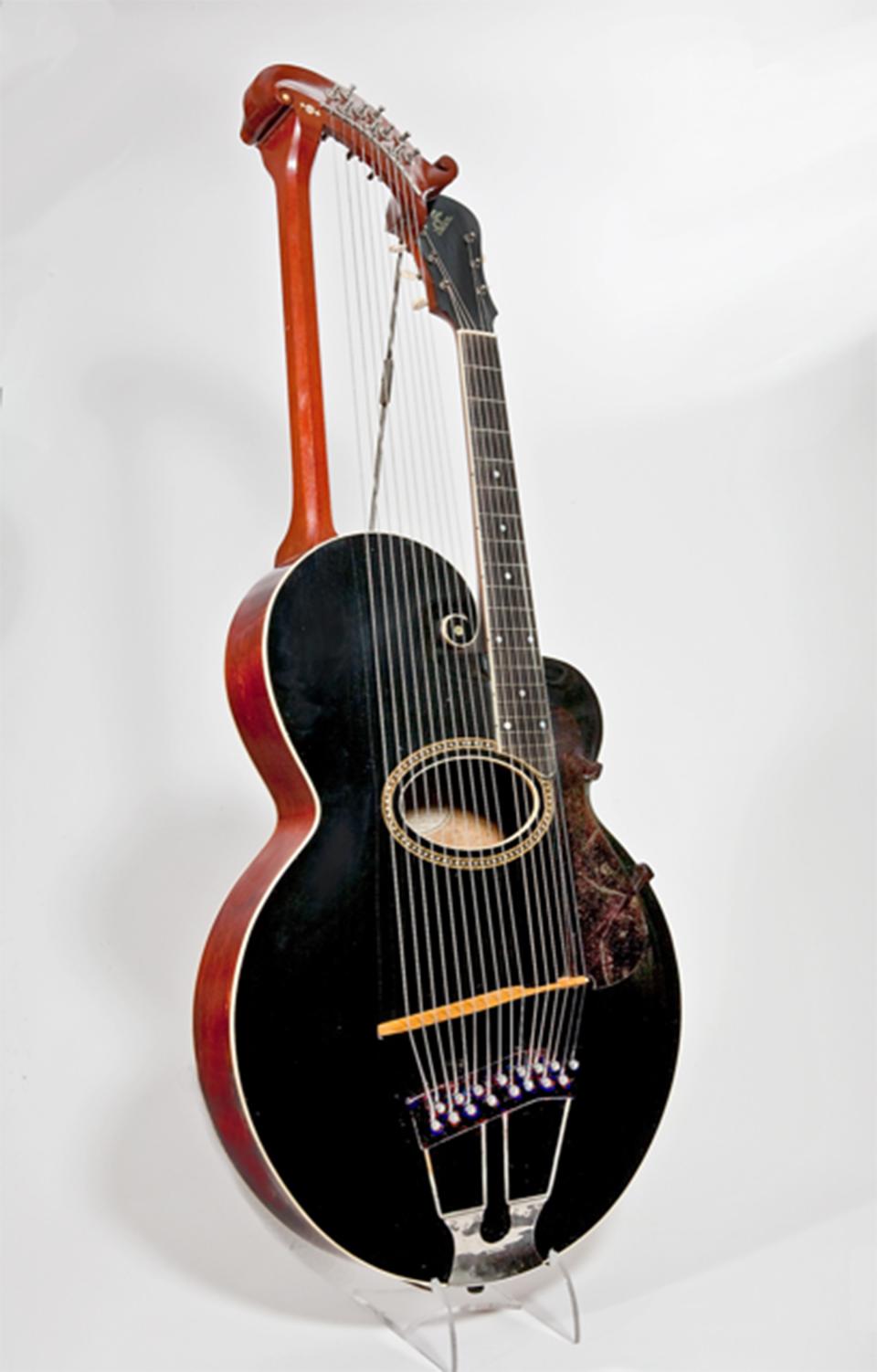 Harp guitar by Gibson Mandolin-Guitar Company, Kalamazoo, Michigan, 1914.  Hawaiian groups often included multi-stringed harp guitars. This one was played upright, like a regular guitar. National Music Museum, University of South Dakota, Bill Willroth, Sr., Photographer. 