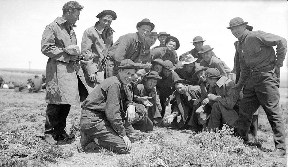 Young recruits to the Civilian Conservation Corps--the CCC-- start up a crap game shortly after arriving at the Encampment depot, 1933. Lora Nichols Collection, Grand Encampment Museum.