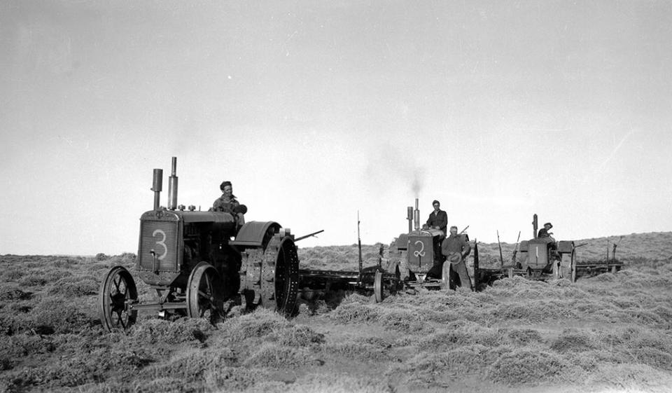 Archie Anderson's three tractors disk up virgin land before planting winter wheat, 1930. Ted Higby photo, Nichols Collection, Grand Encampment Museum.