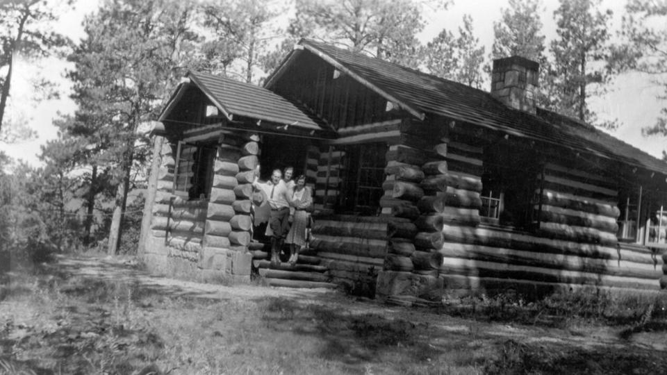 A 1931 log-on-stone custodian’s residence was the first building at Devils Tower National Monument to be designed under official parkitecture standards. NPS.