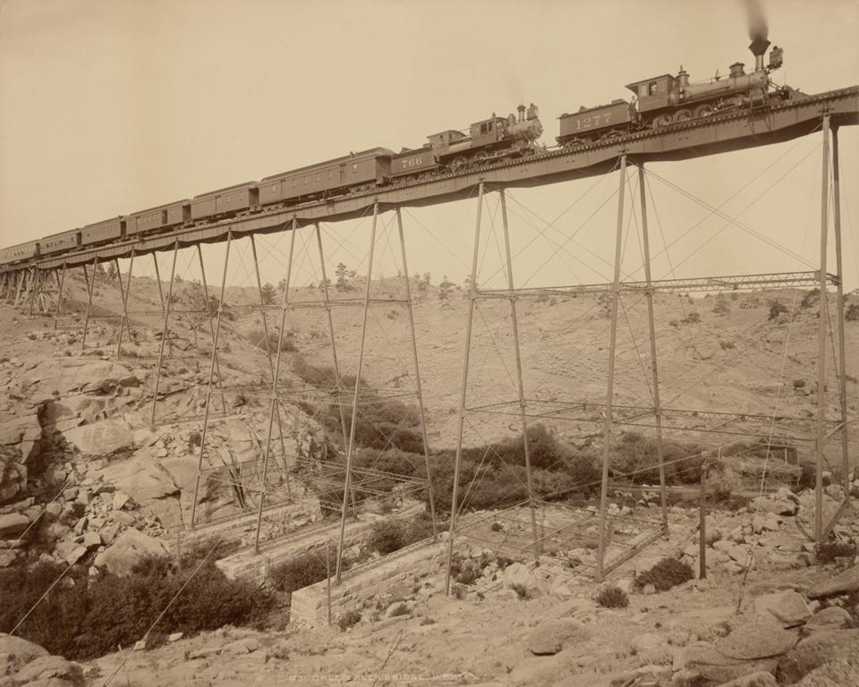 A train crosses the Dale Creek bridge in 1885, after the wooden trestle was replaced by steel. William Henry Jackson, Getty Museum. 