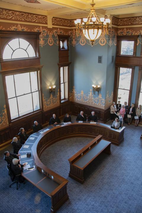 View looking down at the Wyoming Supreme Court justices seated in the restored room